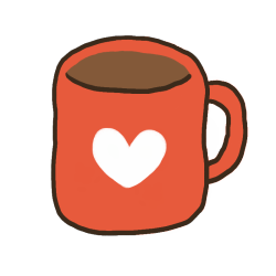 A mug with a brown liquid inside it. It is red with a white heart in the center.